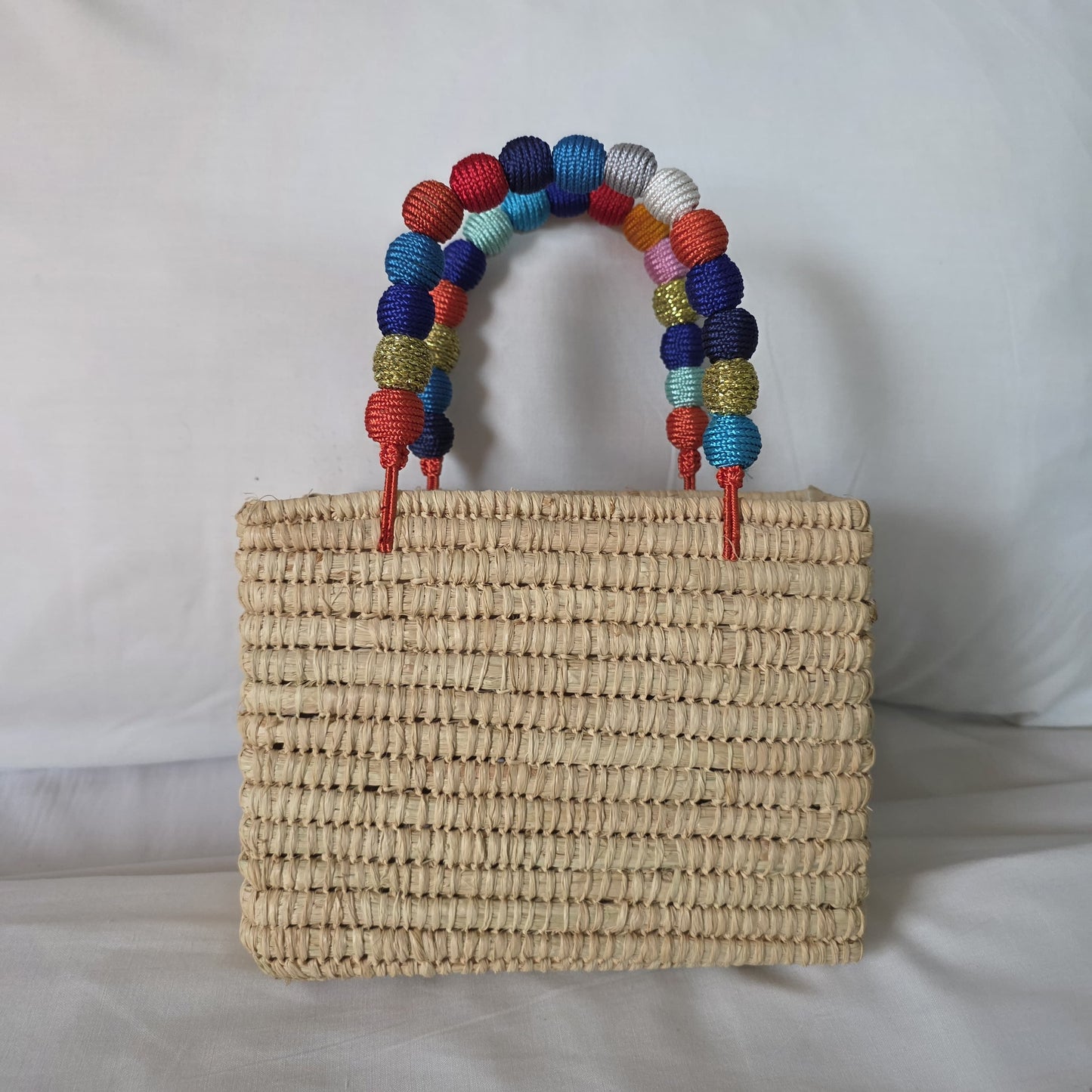 Bolso artesanal de rafia y algodón arcoiris